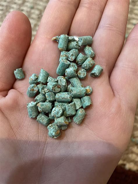 small metal pellets found inside box|Green pellets found in shed. No label on bag. Friable, no  .